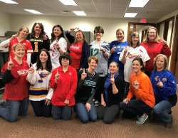Bank employees dressed up as number 1 sports fans